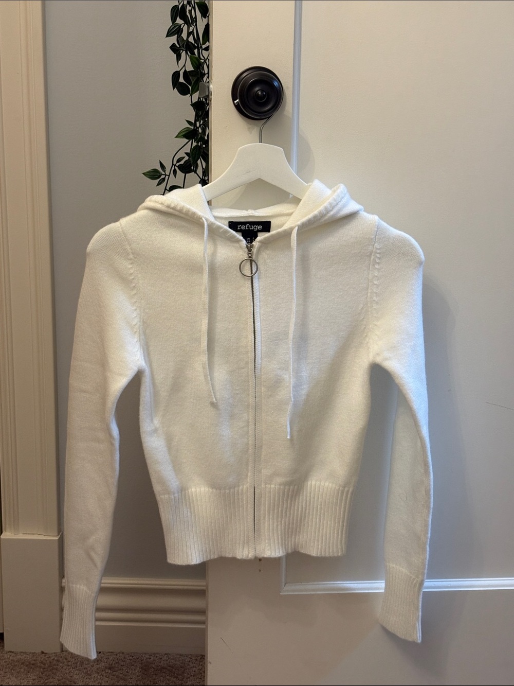 White refuge sweater with star on the back